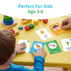 Young child laying Arabic Words flash cards on a yellow table beside toy blocks