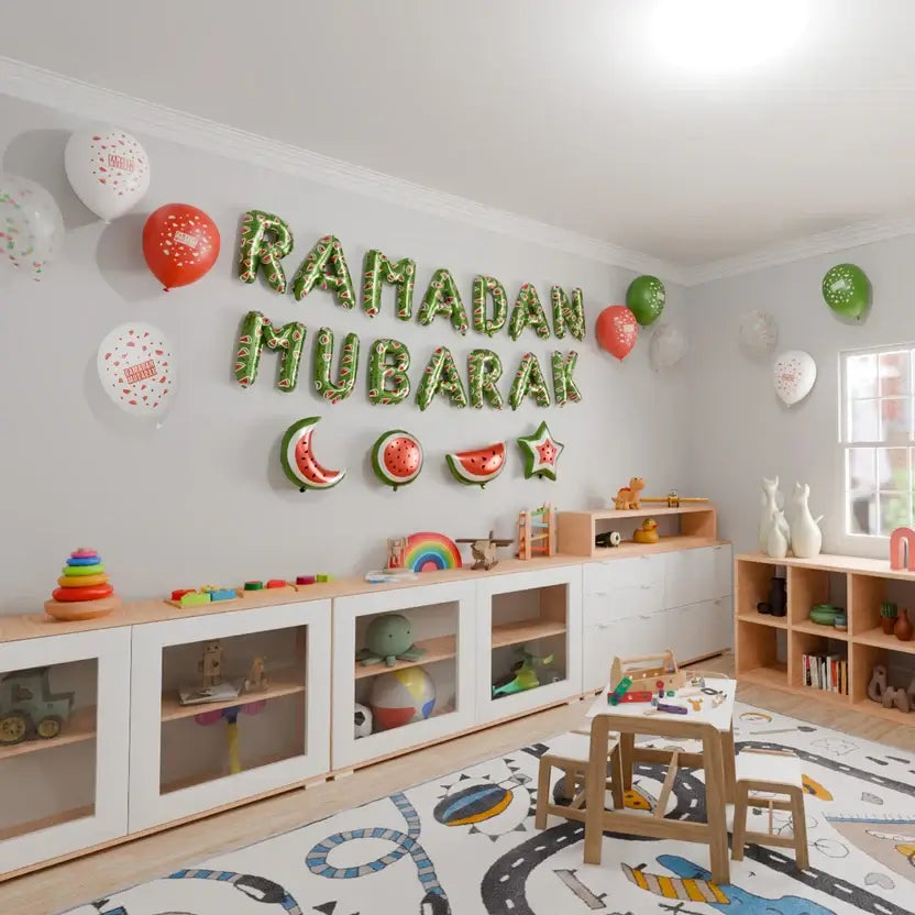 Green Ramadan Mubarak foil letters above a children's play area with a toy shelf and play rug