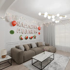 Living room wall decorated with white watermelon-print Ramadan Mubarak foil letters, string lights and balloons