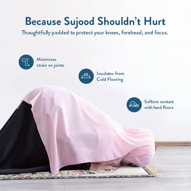 Woman in a pink prayer garment in sujood on the Spring Blossoms padded prayer mat, cushioning knees and forehead