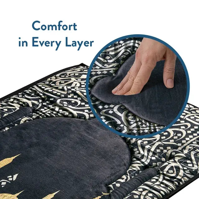 Hand pressing the soft pile of the Dark Arabic Calligraphy padded prayer mat, with its calligraphy border around it