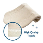 Rolled-up Luxury Sand Arched padded prayer mat with a close-up of its white tassels