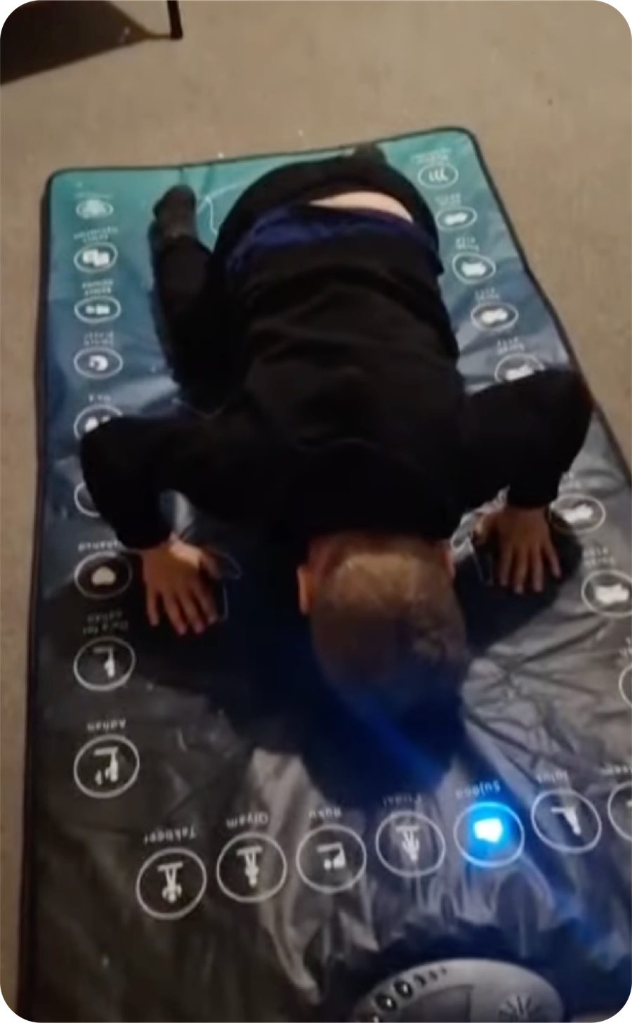 A child in sujood on the interactive prayer mat