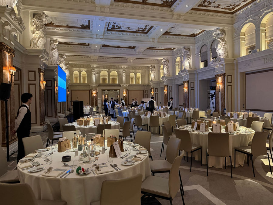 Tables laid for a charity gala dinner