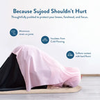 Person in a pink prayer garment in sujood on the Luxury Sand Arched padded mat, with notes on joint comfort
