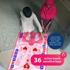 Boy and girl kneeling beside the Kids Interactive Prayer Mat (Pink), seen from above