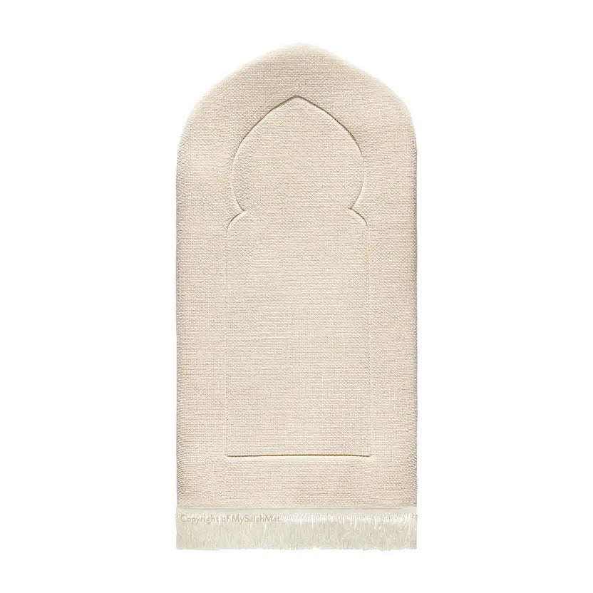 Luxury Sand Arched padded prayer mat from the front, cream woven fabric with an arch outline and white tassels