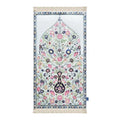 Spring Blossoms padded prayer mat in white with pink and blue flowers and a blue-grey border, shown flat